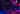 Frau mit Headset und Brille tippt nachts an einem Gaming-Laptop mit RGB-Beleuchtung.