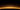 Sonnenaufgang über der Erdatmosphäre mit leuchtendem Horizont vor sternenklarem Weltraum