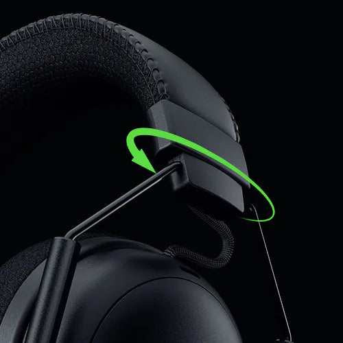 Nahaufnahme des verstellbaren Bügels und der Ohrmuschel eines schwarzen Gaming-Headsets mit grünem Rotationspfeil.