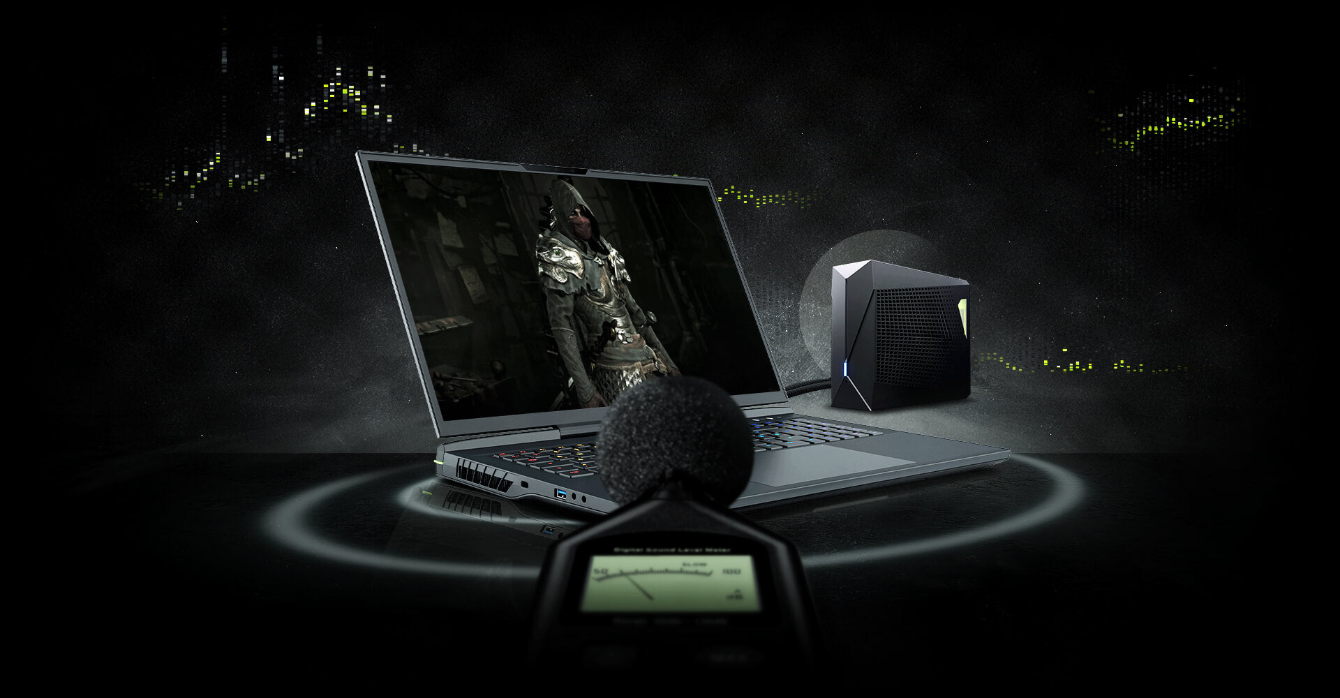 High-End XMG Gaming-Laptop mit externer Wasserkühlung und Schalldruckmessgerät im dunklen Gaming-Setup