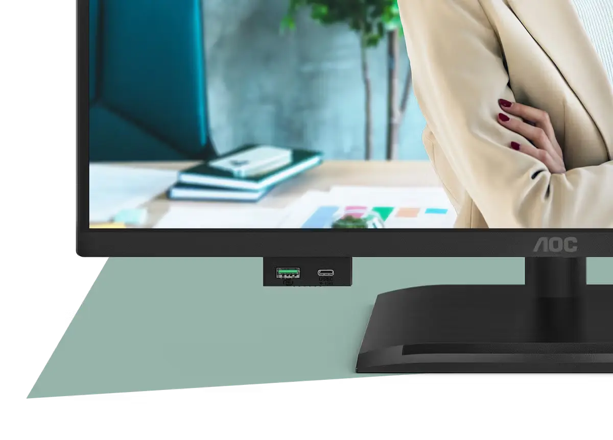 Nahaufnahme des AOC-Monitors mit integrierten USB- und USB-C-Anschlüssen an der Unterseite.