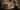 Person arbeitet an einem Laptop mit Videobearbeitungssoftware in einem gemütlichen Homeoffice
