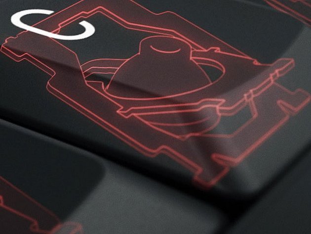 Nahaufnahme einer Laptop-Tastatur mit transparentem Scherenmechanismus unter einer Taste.
