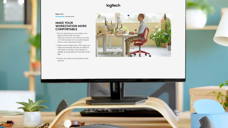 Monitor zeigt Logitech Ergonomie-Guide zur optimalen Ausrichtung eines modernen Arbeitsplatzes