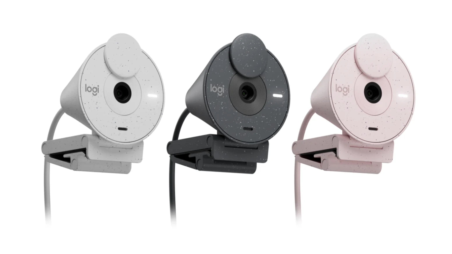 Drei Logitech Webcams in den Farben Weiß, Schwarz und Rosa nebeneinander vor weißem Hintergrund.